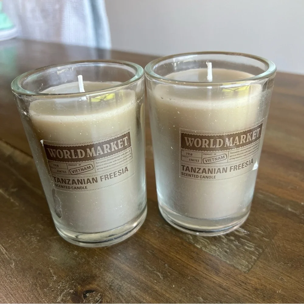 Cost Plus World Market gray Tanzanian Freesia scented candles. Set of 2 3in x 4